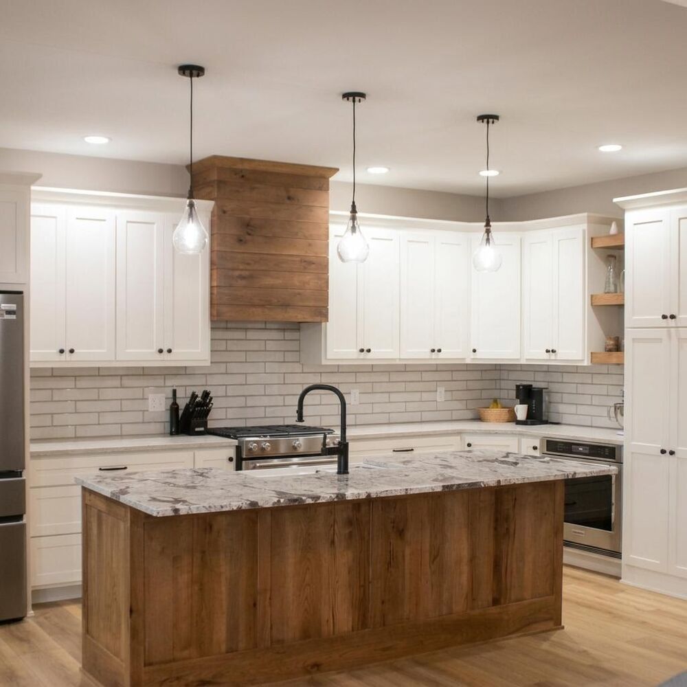 Custom kitchen in Pavilion, NY with white shaker cabinets, a rustic hickory island, and a matching plank-clad range hood